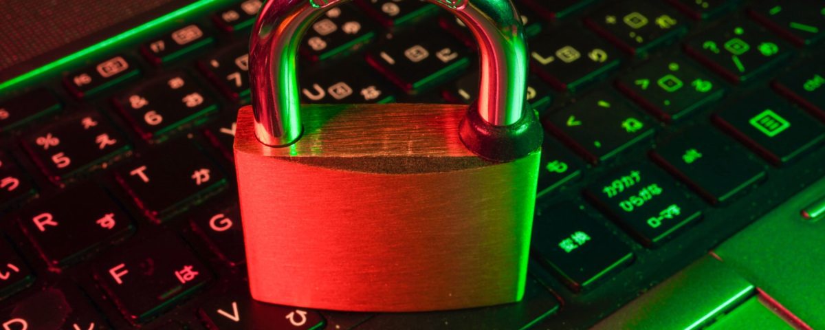 red padlock on black computer keyboard