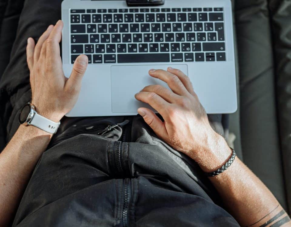 Free A Person Working on His Laptop Stock Photo