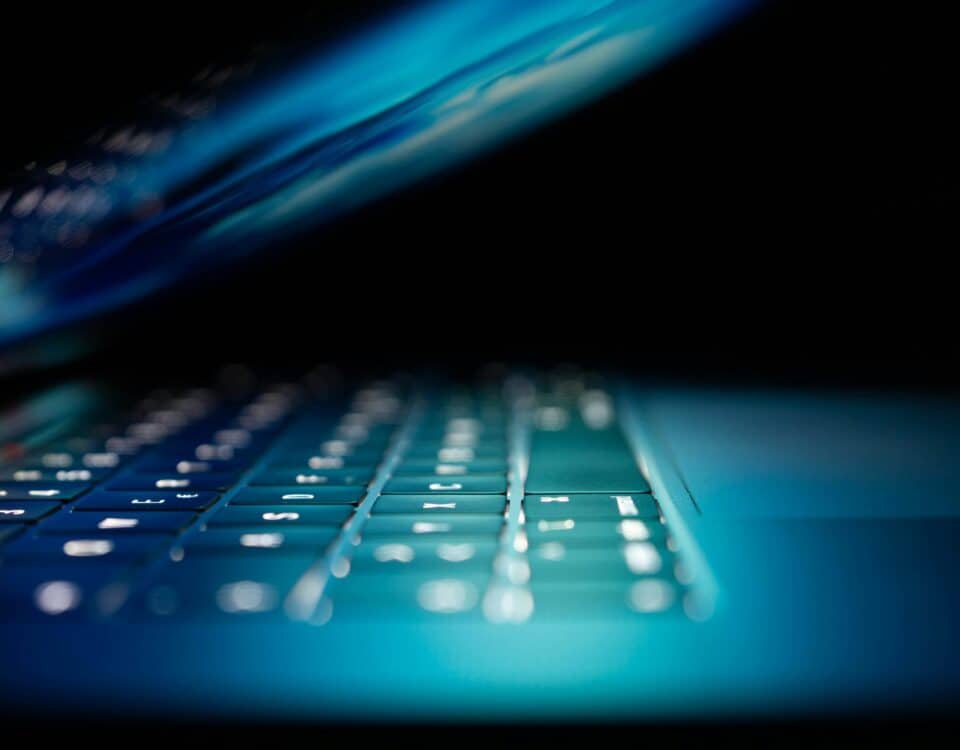 closeup photo of turned-on blue and white laptop computer